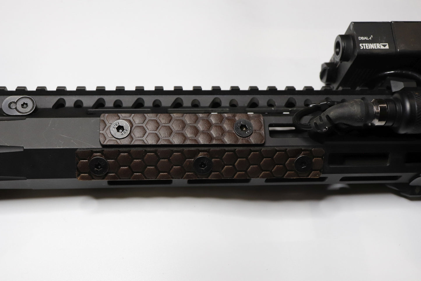 Handcrafted leather rail grip for MLOK rifle rails, featuring a textured surface with 1mm of g10 material on back for heat resistance, cool, new, best handguard.