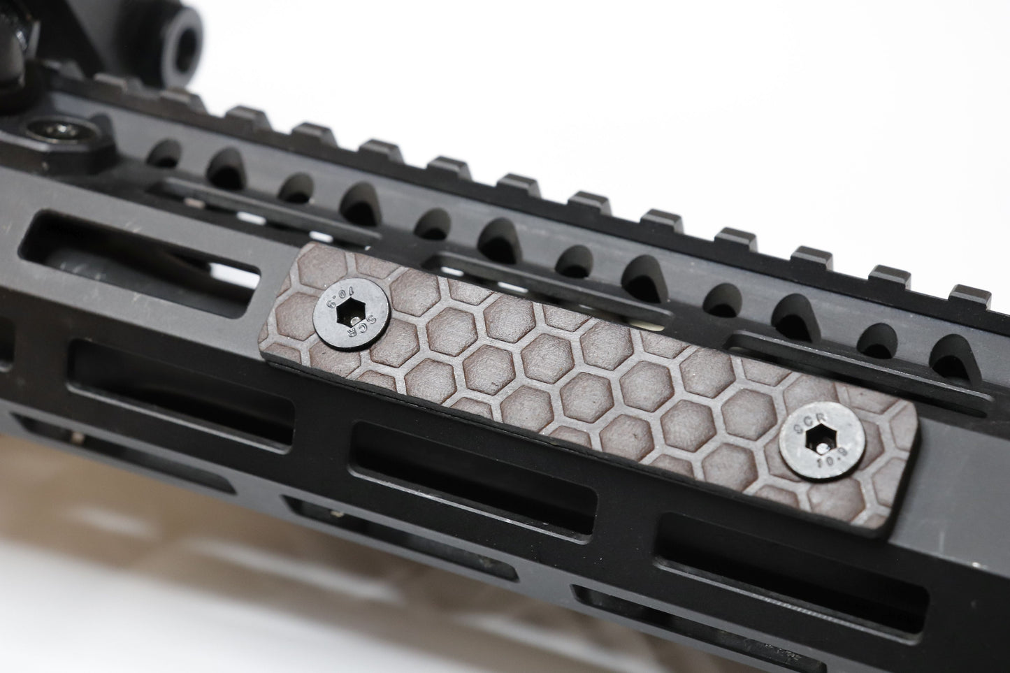 Handcrafted leather rail grip for MLOK rifle rails, featuring a textured surface with 1mm of g10 material on back for heat resistance, cool, new, best handguard.