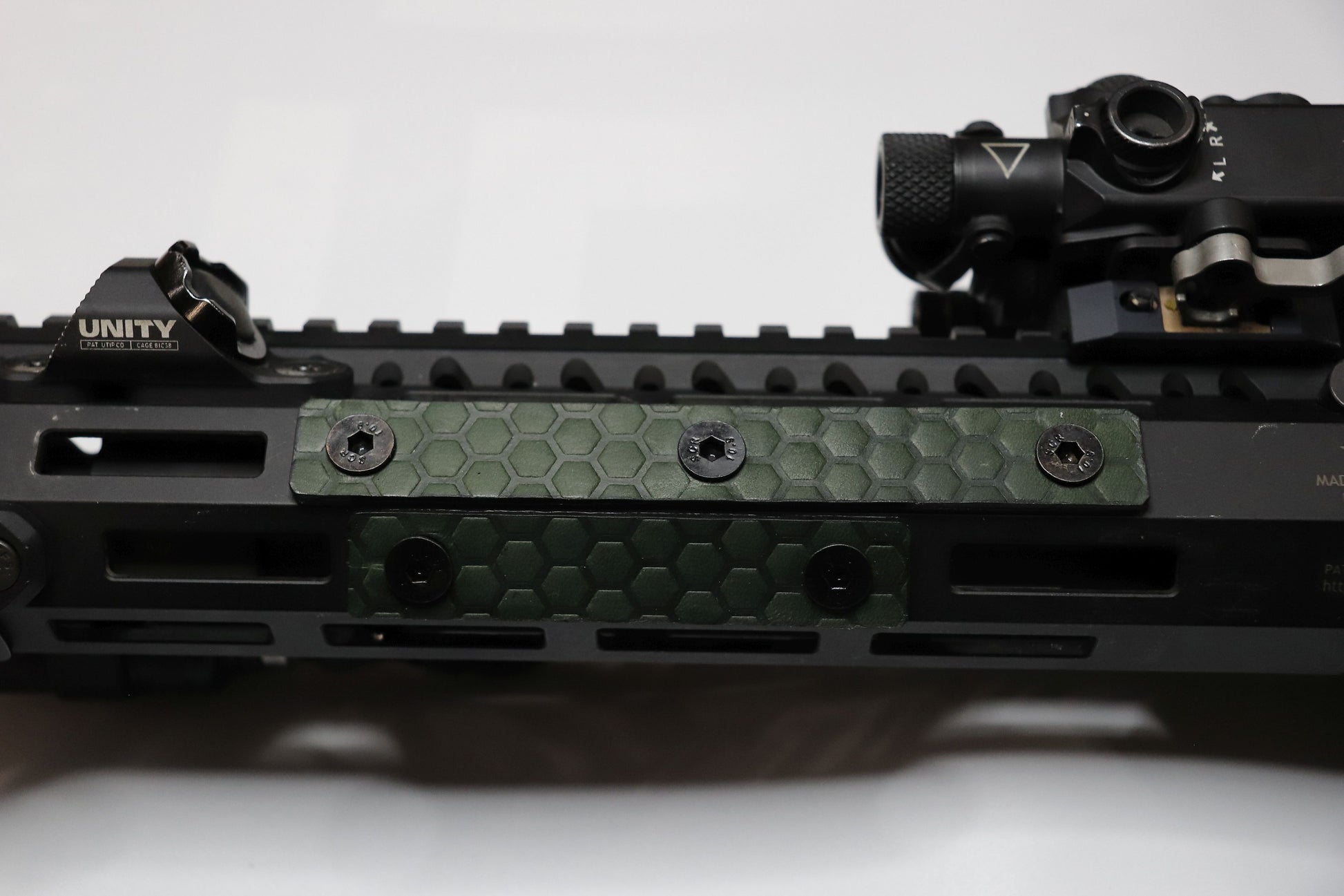 Handcrafted leather rail grip for MLOK rifle rails, featuring a textured surface with 1mm of g10 material on back for heat resistance, cool, new, best handguard.