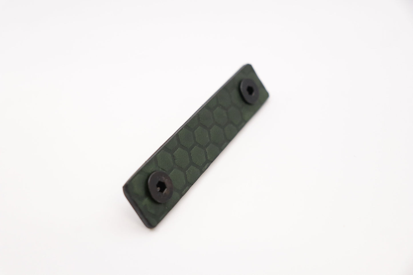 Handcrafted leather rail grip for MLOK rifle rails, featuring a textured surface with 1mm of g10 material on back for heat resistance, cool, new, best handguard.