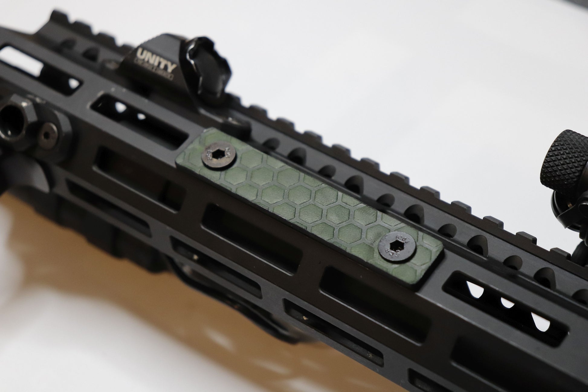 Handcrafted leather rail grip for MLOK rifle rails, featuring a textured surface with 1mm of g10 material on back for heat resistance, cool, new, best handguard.