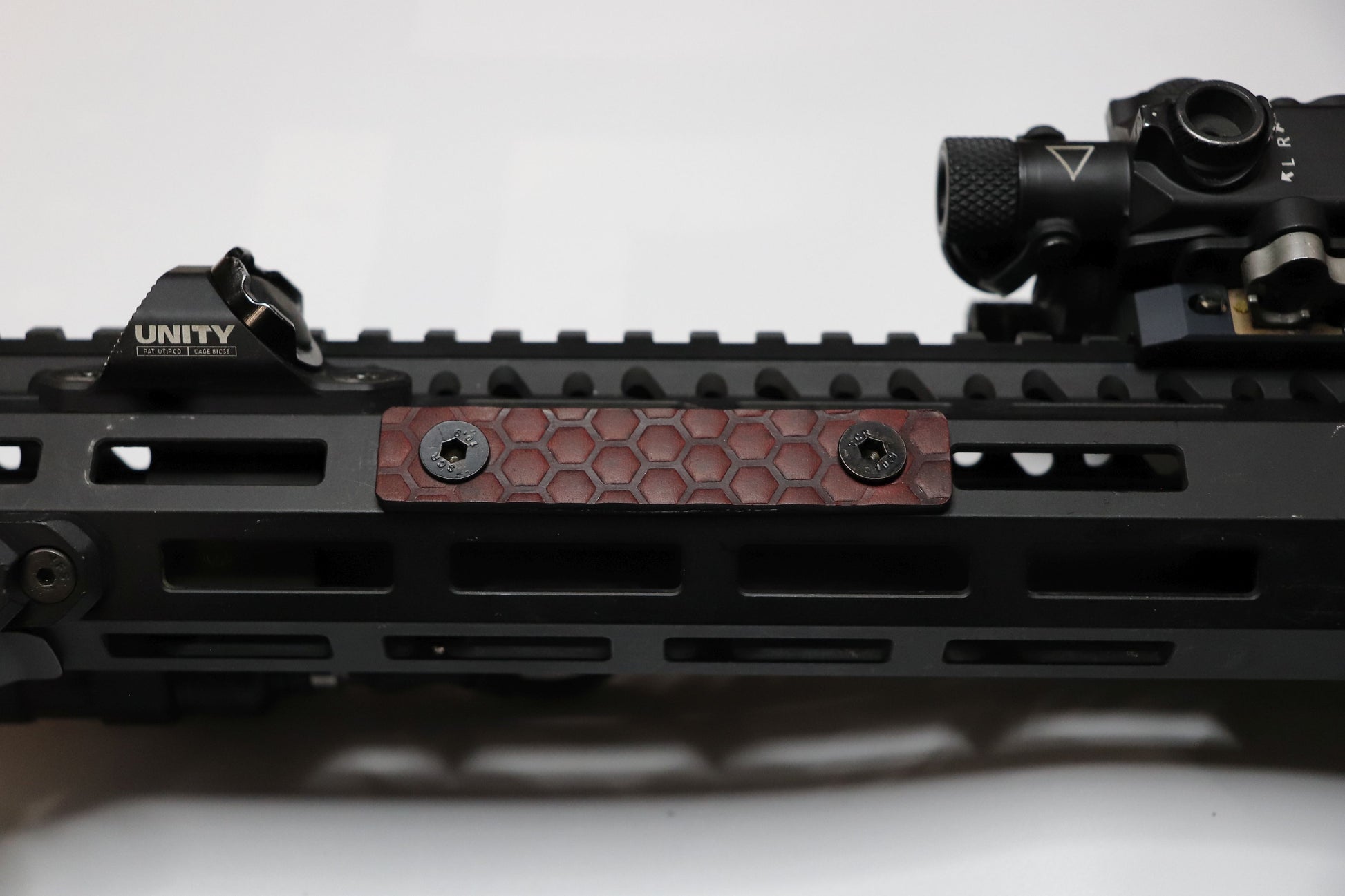 Handcrafted leather rail grip for MLOK rifle rails, featuring a textured surface with 1mm of g10 material on back for heat resistance, cool, new, best handguard.