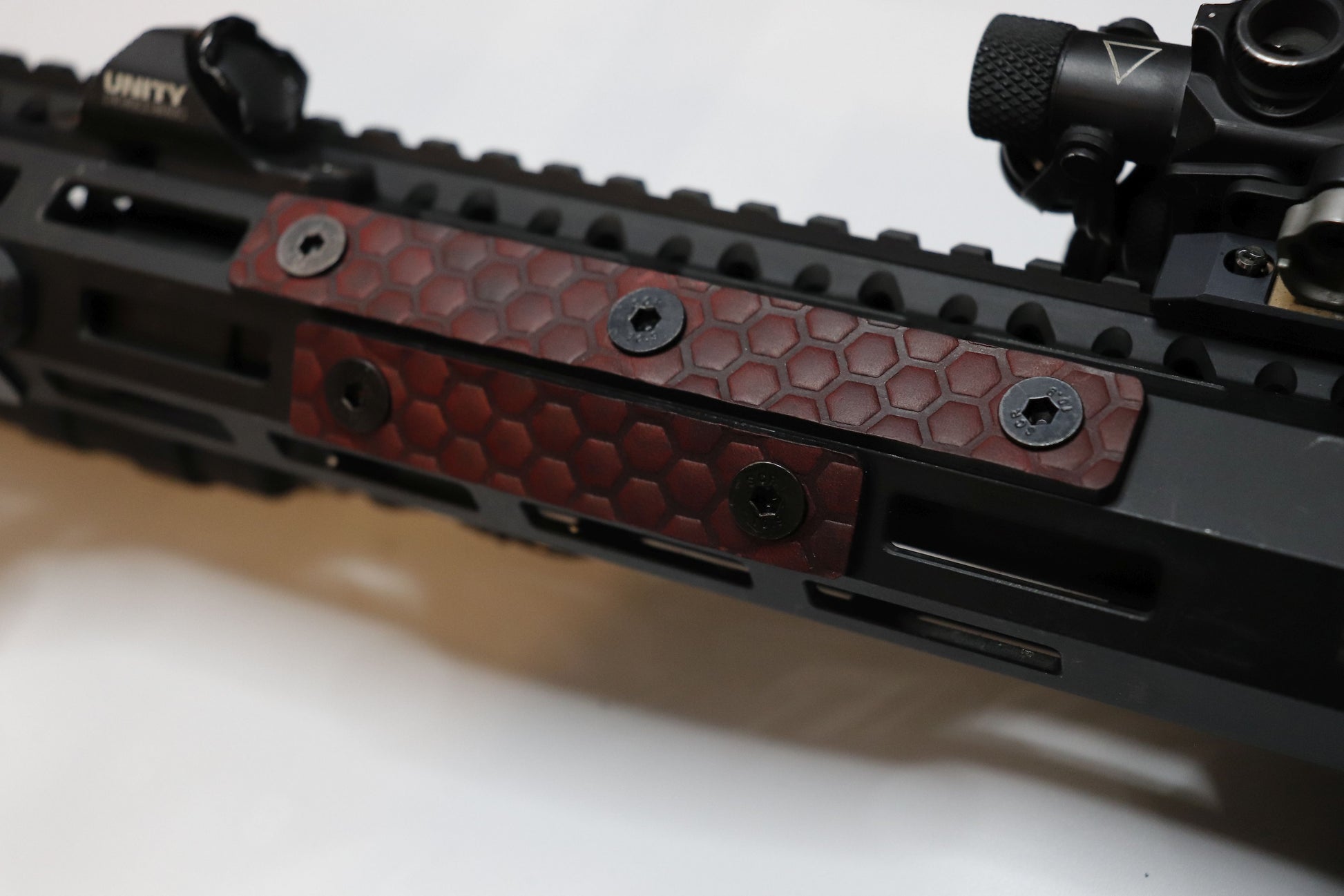 Handcrafted leather rail grip for MLOK rifle rails, featuring a textured surface with 1mm of g10 material on back for heat resistance, cool, new, best handguard.