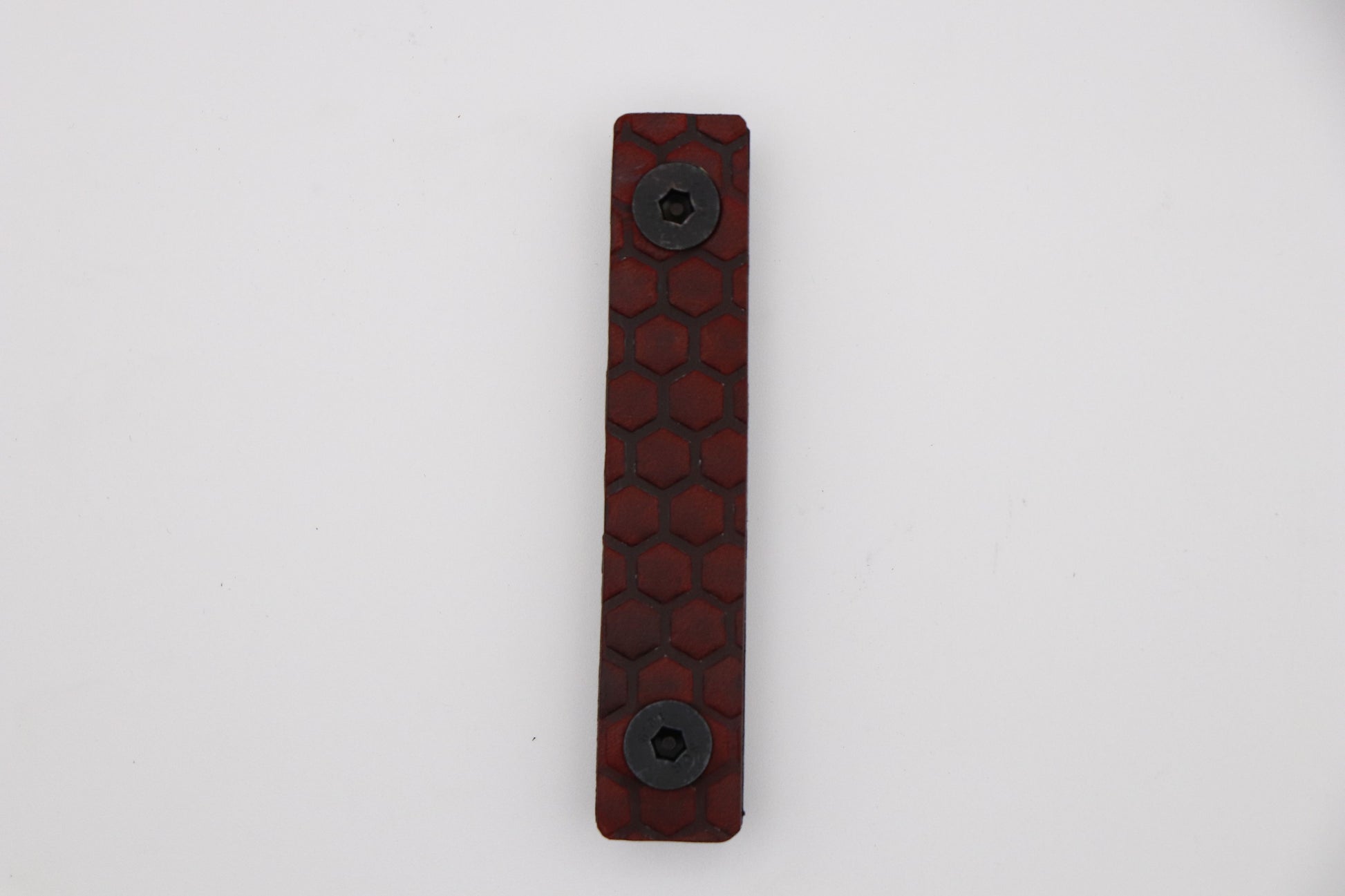 Handcrafted leather rail grip for MLOK rifle rails, featuring a textured surface with 1mm of g10 material on back for heat resistance, cool, new, best handguard.