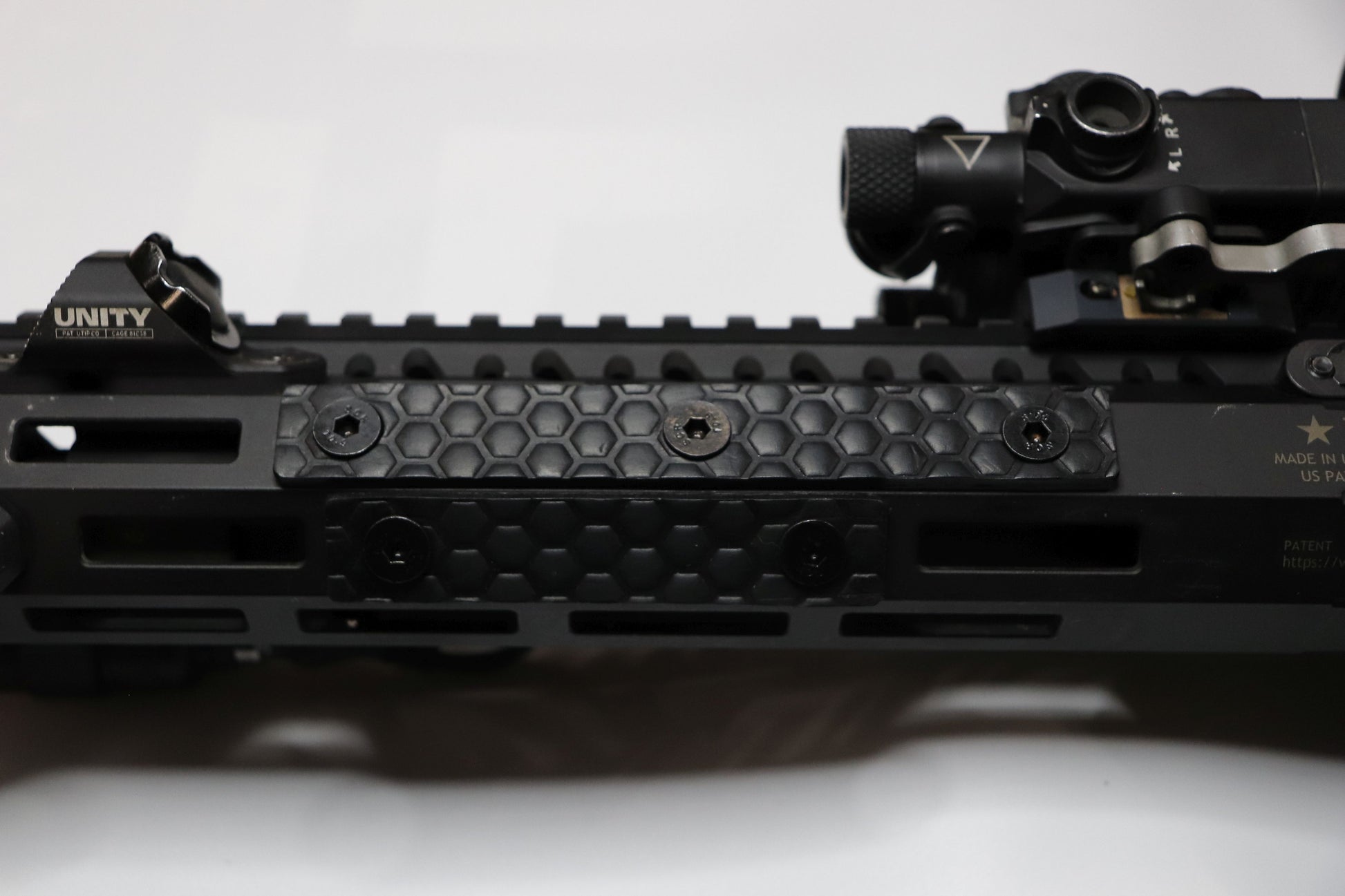 Handcrafted leather rail grip for MLOK rifle rails, featuring a textured surface with 1mm of g10 material on back for heat resistance, cool, new, best handguard.