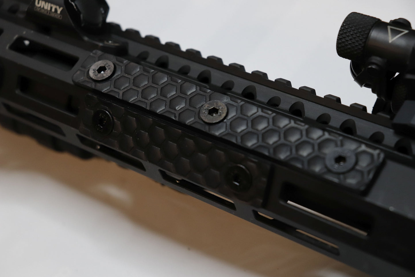 Handcrafted leather rail grip for MLOK rifle rails, featuring a textured surface with 1mm of g10 material on back for heat resistance, cool, new, best handguard.