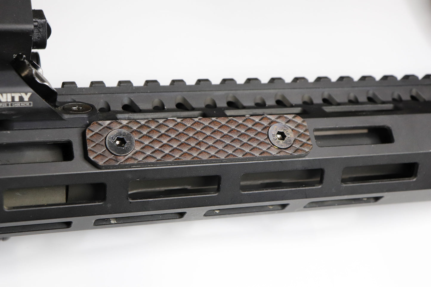 Handcrafted leather rail grip for MLOK rifle rails, featuring a textured surface with 1mm of g10 material on back for heat resistance, cool, new, best handguard.