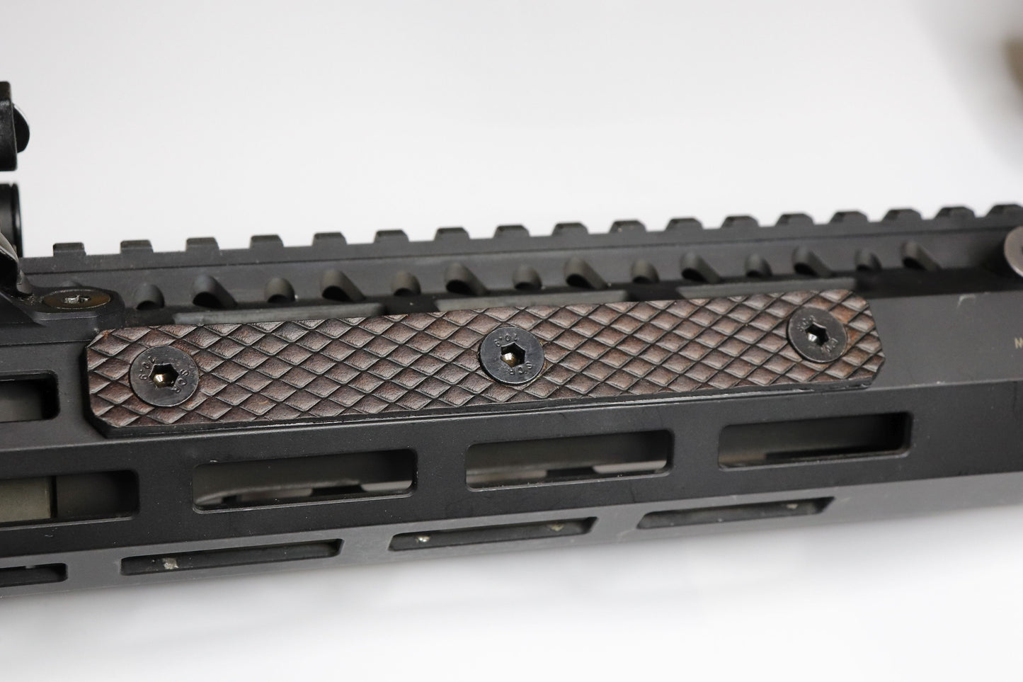 Handcrafted leather rail grip for MLOK rifle rails, featuring a textured surface with 1mm of g10 material on back for heat resistance, cool, new, best handguard.